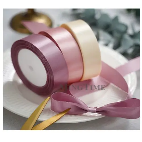 [33174] 2" GLITTERED PLASTIC  RIBBON COLORS: GOLD, MAUVE, F. PINK,  H. PINK, WHITE, YELLOW
